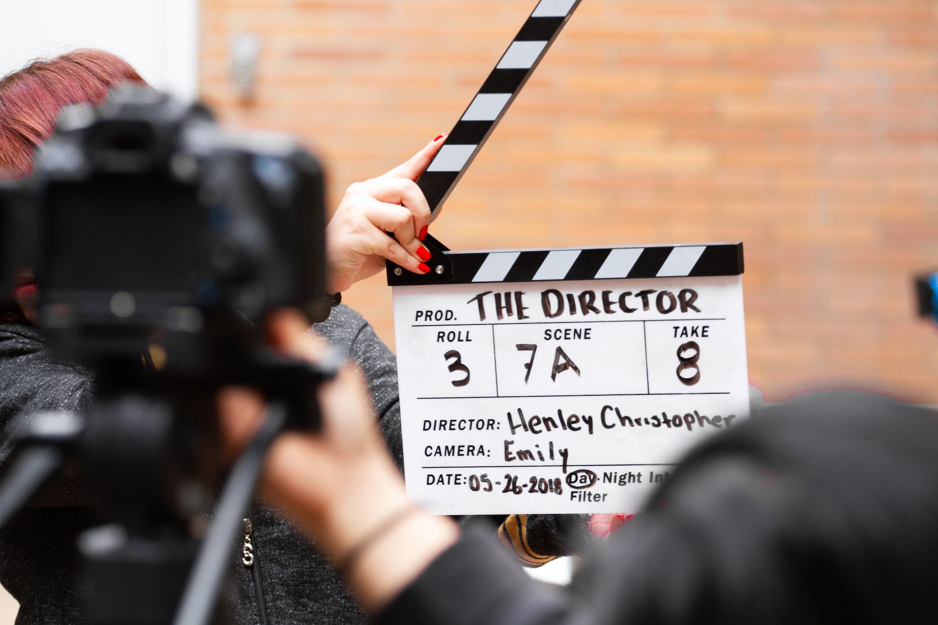 man holding clapper board