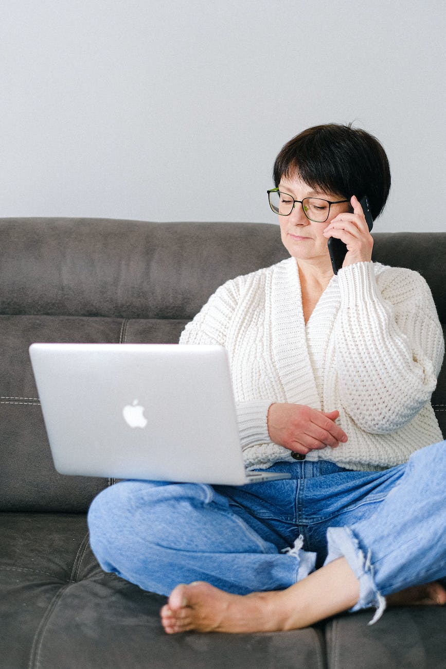 close up shot of an elderly woman with eyeglasses having a phone call, senior tech challenges
